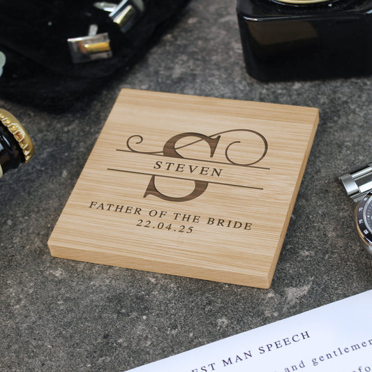 Wooden coaster with engraved text on a textured surface