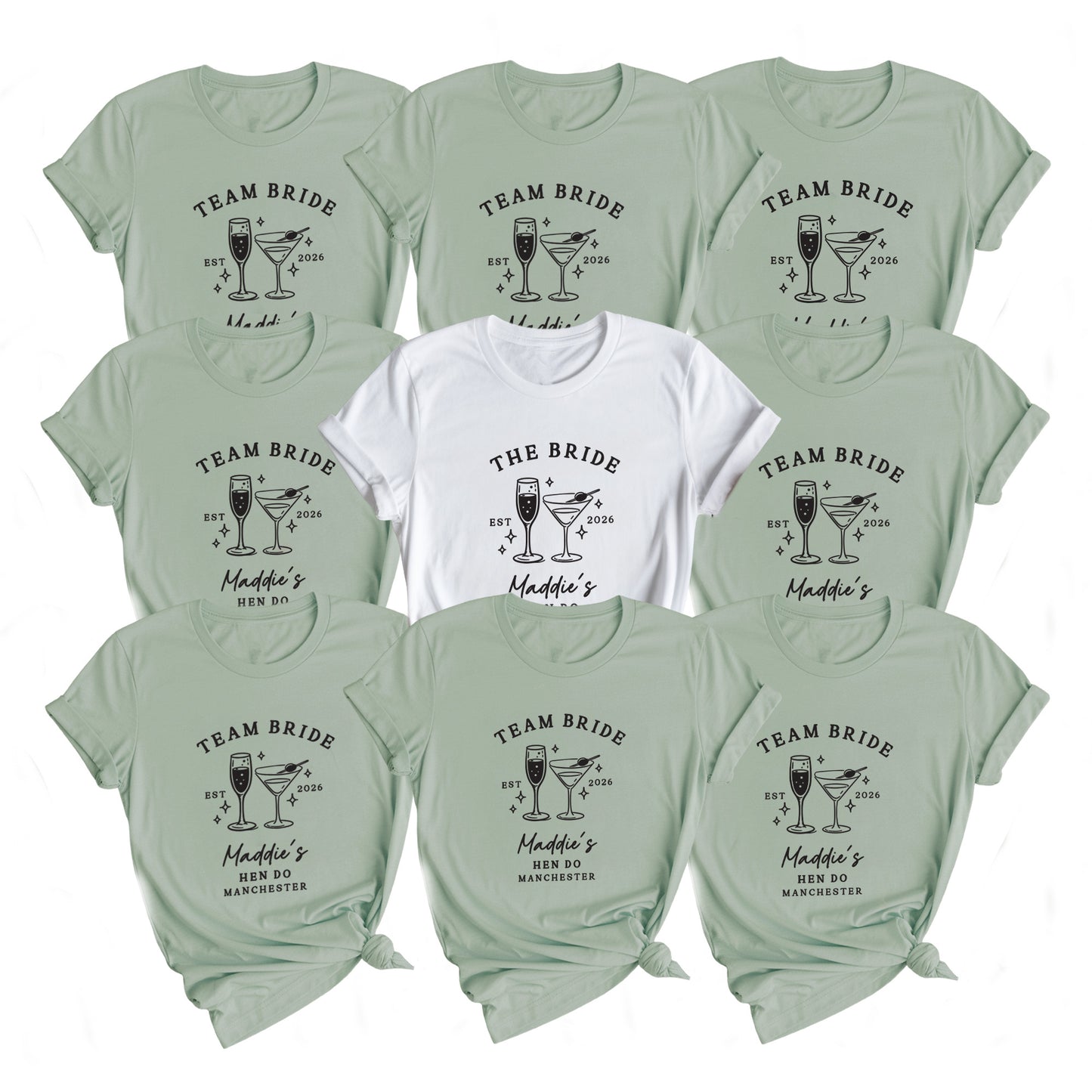 A flat lay of ten short-sleeve graphic T-shirts arranged in a grid on a white background. Nine shirts are a pale sage green with a black 'Team Bride' cocktail graphic, and the center shirt is white with a black 'The Bride' cocktail graphic.