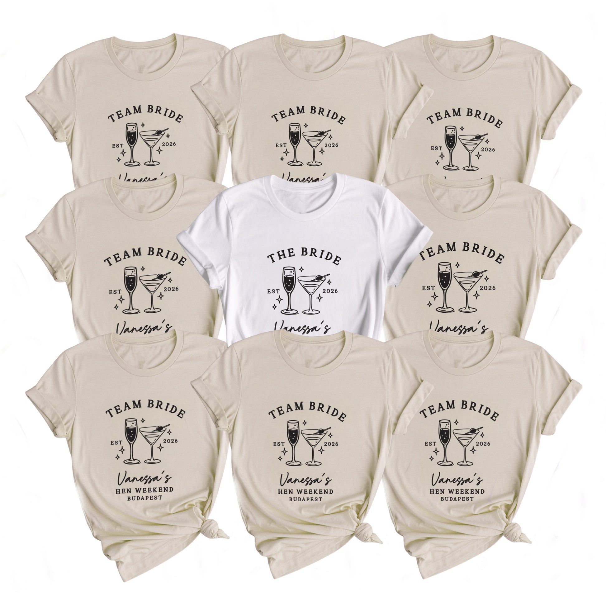 Nine short-sleeve graphic T-shirts arranged in a 3x3 grid on a white background. Eight shirts are a warm light beige/cream color and one center shirt is white.
